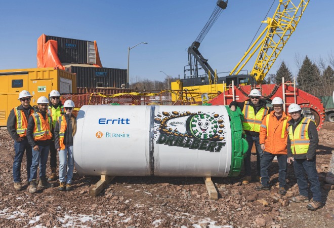 Construction workers posing with Drillbert