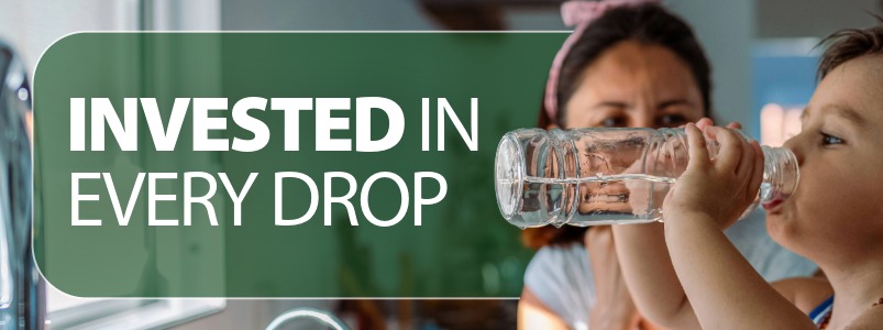 A person drinking a glass of water.