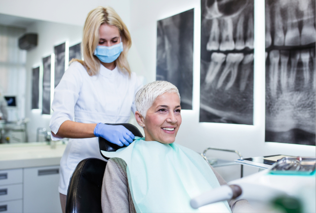 Dentist with patient of an older age.