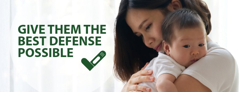 A mother holding her baby with the words "give them the best possible defense against RSV."