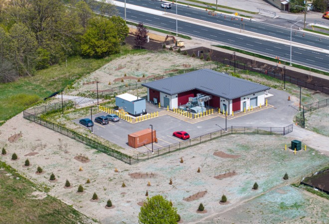 An aerial photo of a small recently constructed building.
