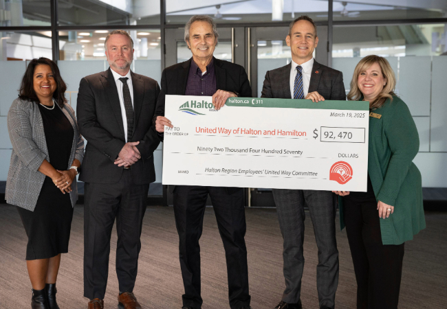 Presenting the cheque from the 2024 staff fundraising campaign to United Way.