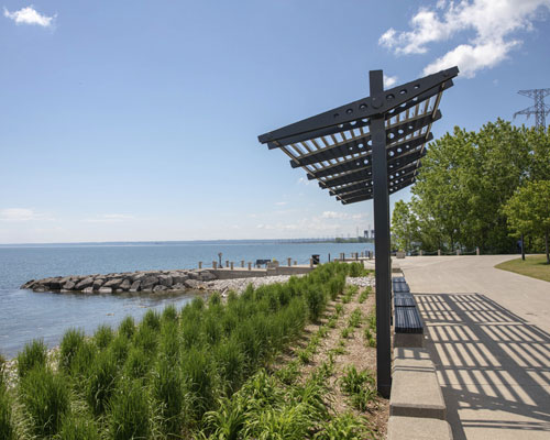 A shade structure overlooking the waterfront at Burlington Beach.