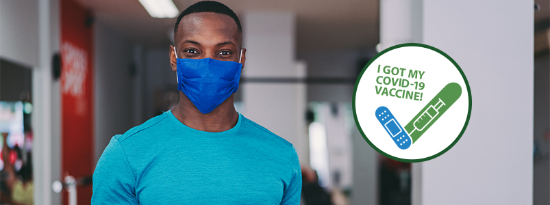image of vaccinated fitness instructor in face mask