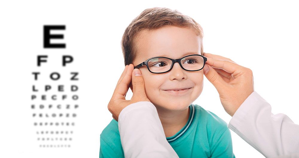 Child wearing glasses at an eye exam
