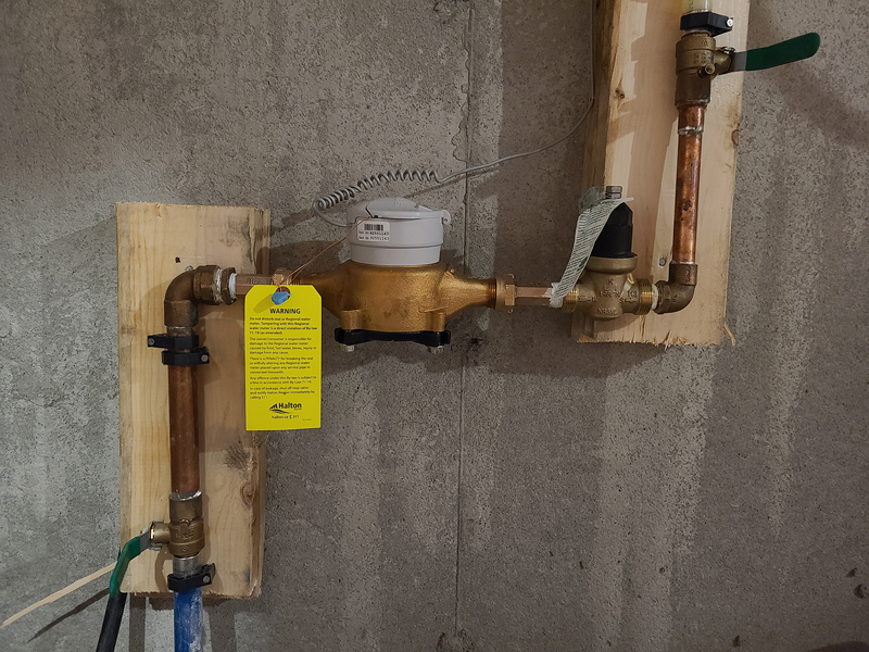 A water meter is installed in a customer’s property. As part of AMI, your water meter will be connected to a radio transmitter that will allow for remote meter reading