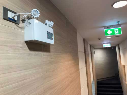 hallway in apartment building with exit sign