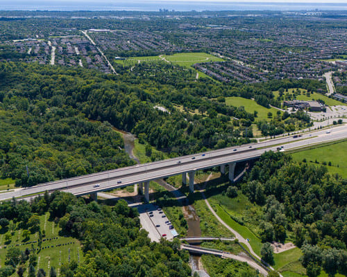 An aerial view of the Dundas Street bridge over Lion's Valley Park in Oakville