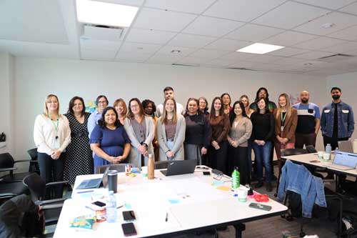 Group picture of staff and community partners involved in Building Safer Communities initiative.