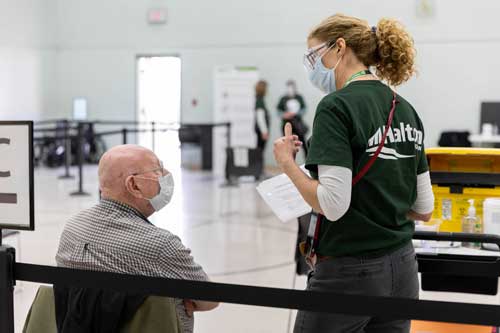 staff working at a vaccine clinic