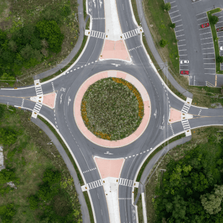 A direct overhead view of a large roundabout intersection.